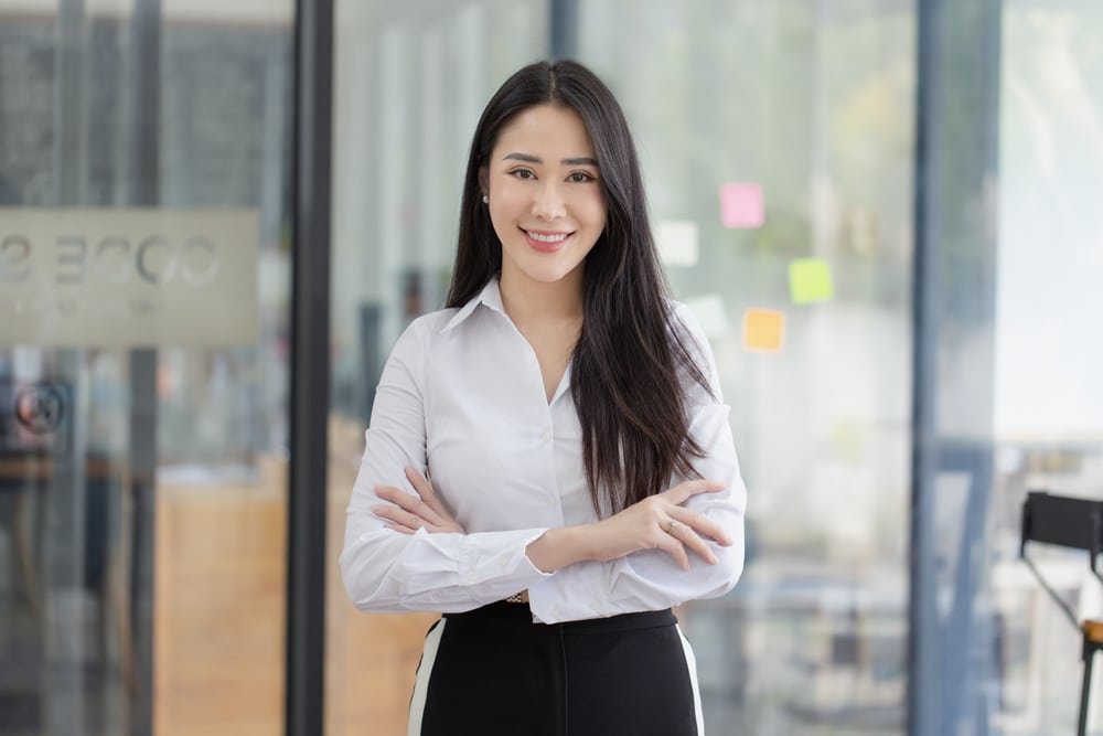 Successful,Businesswoman,Standing,In,Office,,Portrait,Of,Asian,Smiling,Woman