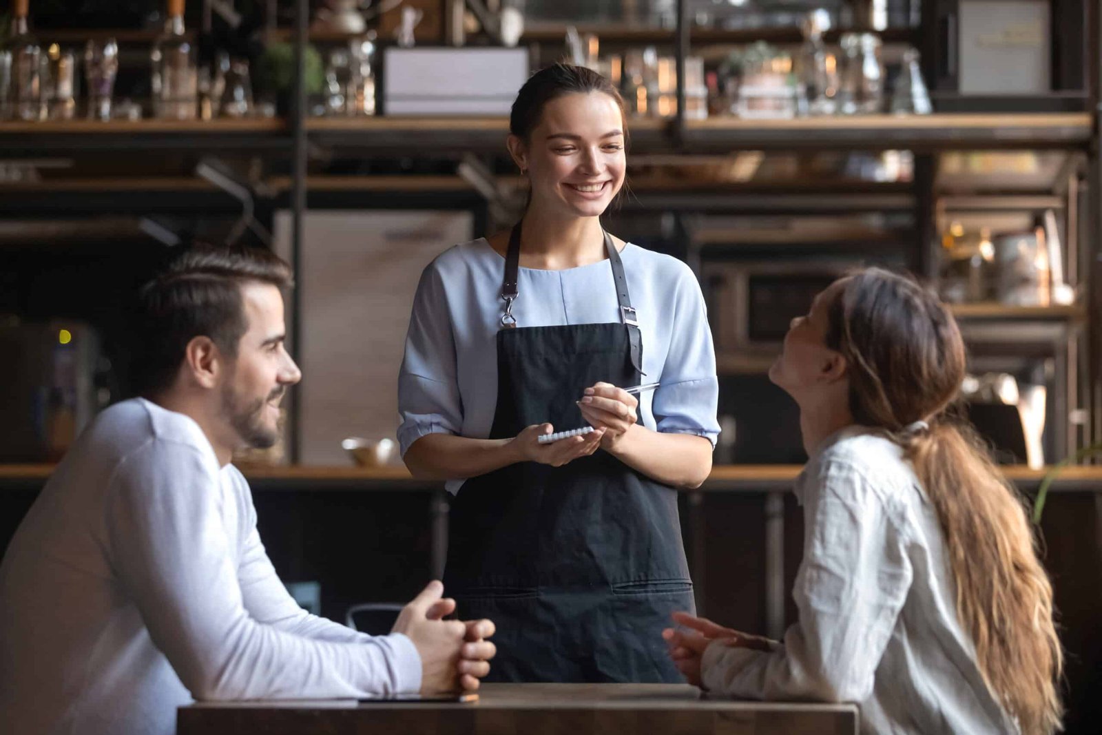 Smiling,Waitress,Wear,Apron,Hold,Notepad,Pen,Take,Order,Talk