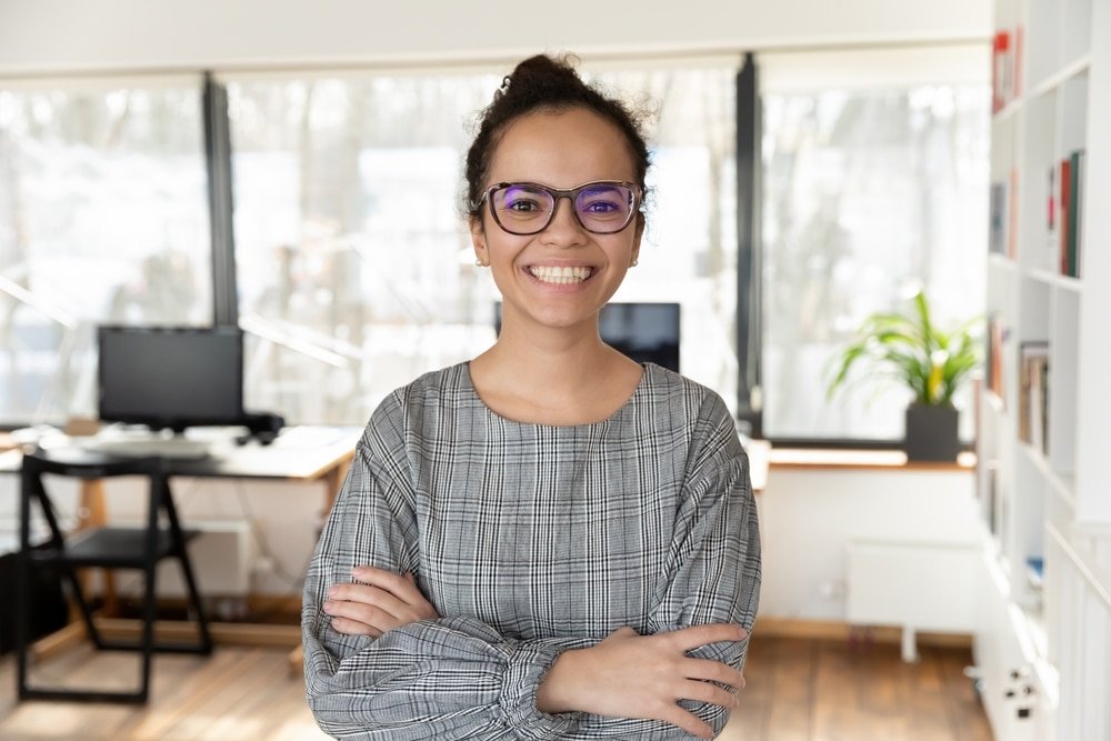 Head,Shot,Portrait,Of,Smiling,African,American,Businesswoman,With,Arms