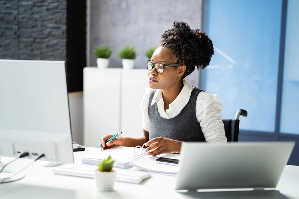 Disabled,African,Accountant,Working,On,Computer,In,Wheelchair