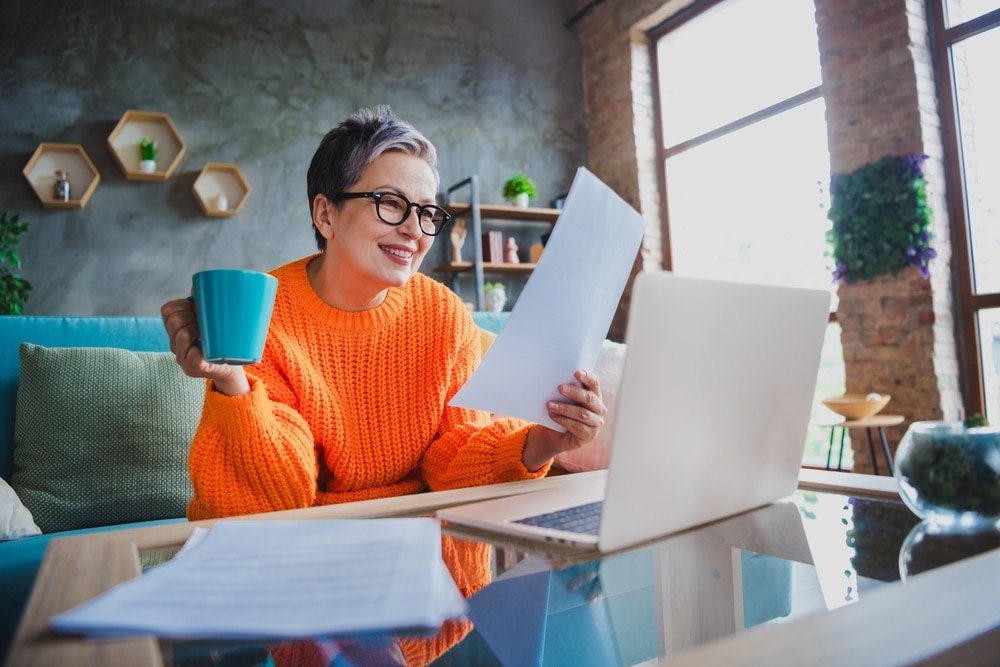 Photo,Of,Smiling,Positive,Elderly,Lady,Wear,Orange,Pullover,Working