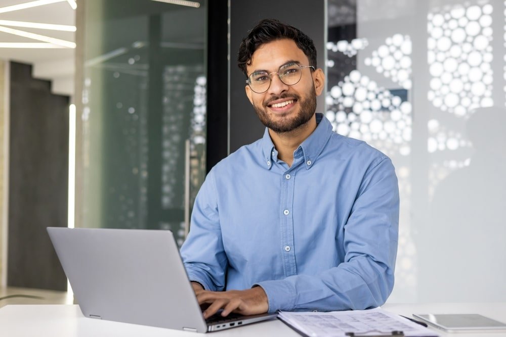 Portrait,Of,Young,Successful,Businessman,Inside,Office,,Satisfied,Joyful,Indian