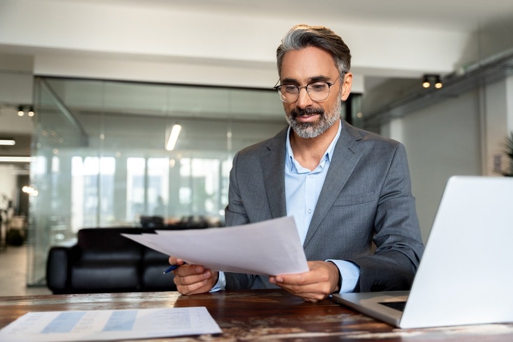 Smiling,Latin,Or,Indian,Male,Business,Man,Accountant,Analyst,Holding