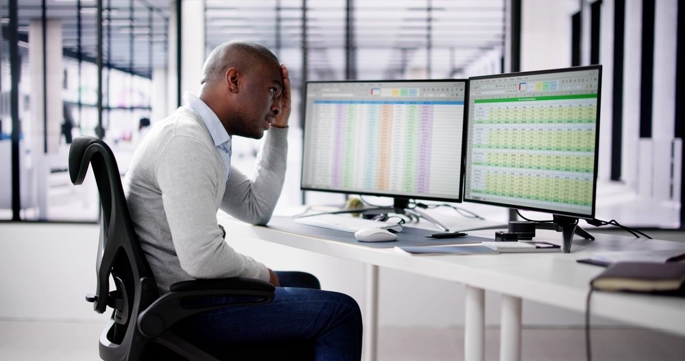 Data,Analyst,African,Man,Using,Spreadsheet,On,Computer