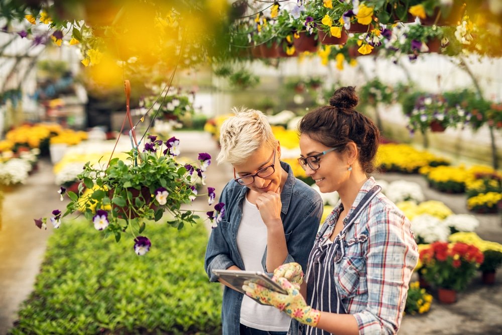 Adorable,Charming,Professional,Modern,Florist,Woman,Showing,A,List,Of